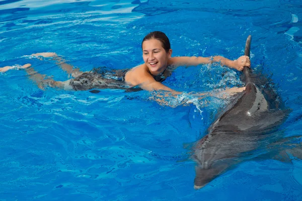 Girl swimming with Dolphin