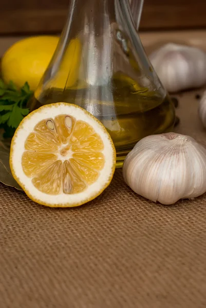 Slices of lemon, garlic cloves and parsley on white background