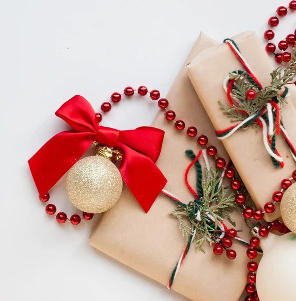 Silver Christmas balls and gifts on wooden table