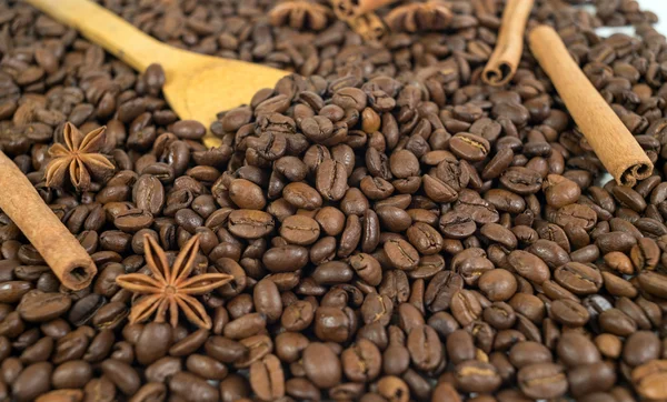 Lots of coffee beans. Two anise stars, three sticks of cinnamon.