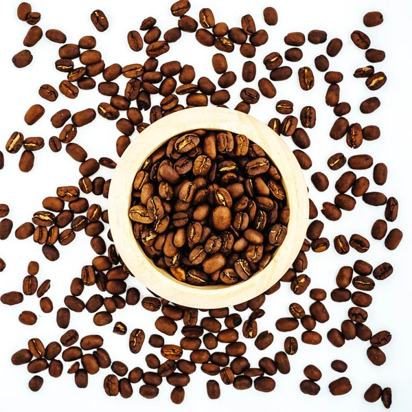 Coffee beans in wooden bamboo mortar isolated on white background. coffee beans isolated on white background.