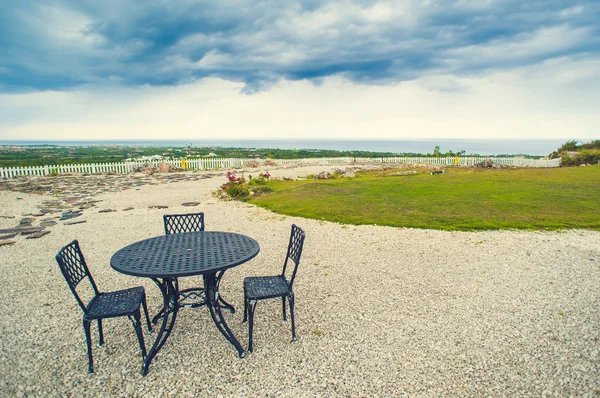 Table setting in tropical Outdoor restaurant at the beach. Cafe on seashore, ocean and sky. Dominican Republic, Caribbean. Relax. remote Paradise.