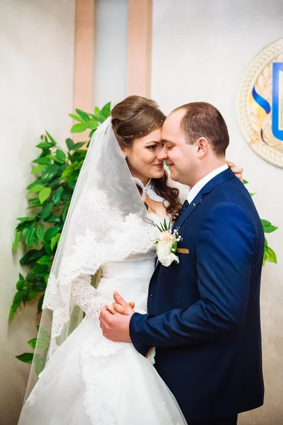 The marriage register. Bride and Groom Signing Marriage Certificate. Young couple signing wedding documents.