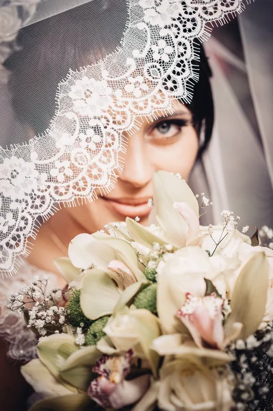 Portrait of the bride with a veil. Wedding theme.