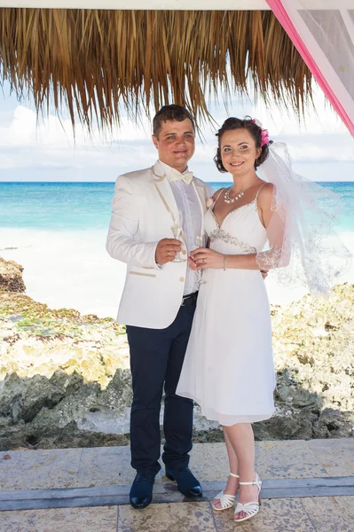 Couple getting marriage on the tropical caribbean beach.