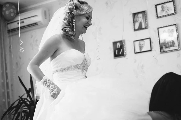 Bride getting ready. beautiful bride in white wedding dress with hairstyle and bright makeup. Happy sexy girl waiting for groom. Romantic lady in bridal dress have final preparation for wedding.