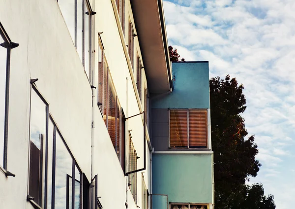 Apartment building with windows open