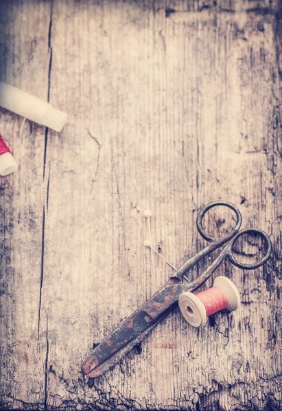 Scissors and bobbins with threads