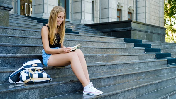Beautiful girl with a book