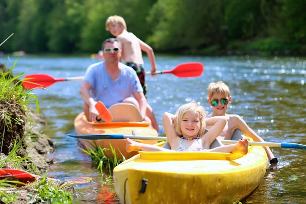 Family kayaking on the river