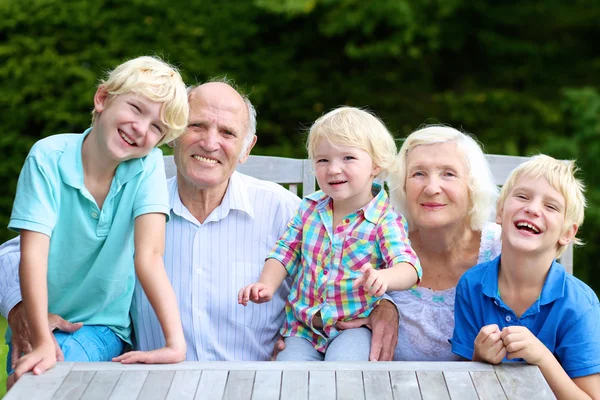 Grandparents with grandkids outdoors