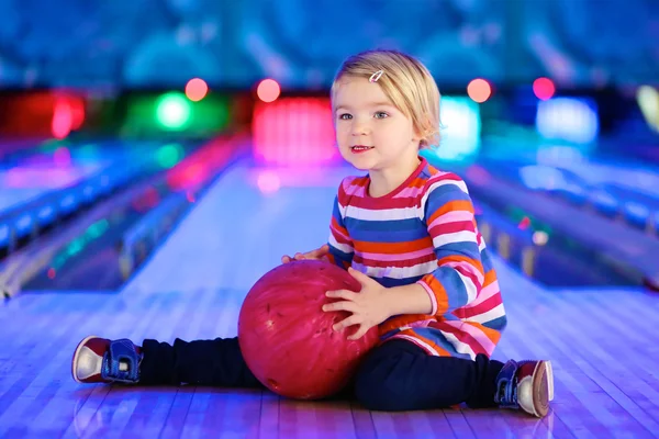 Little girl enjoying bowling
