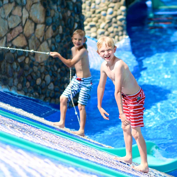 Two boys having fun in water park