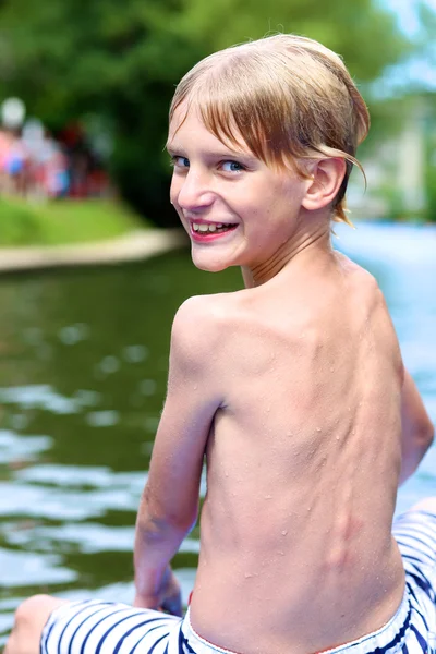 Active boy kayaking on the river