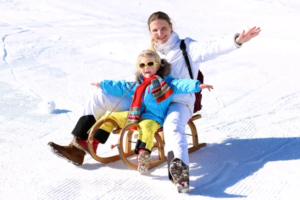 Mother and child having fun at winter