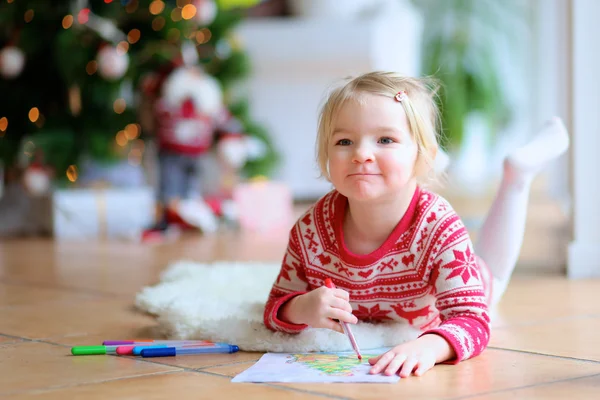 Lovely little girl writing letter to Santa