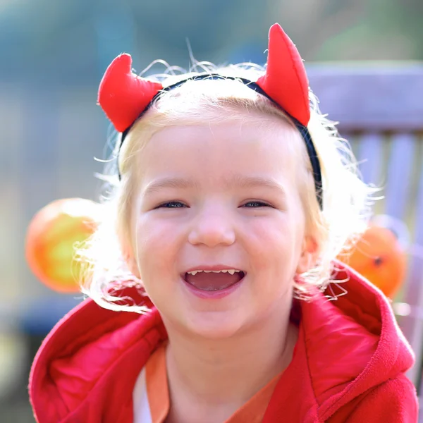 Happy preschooler girl enjoying Halloween