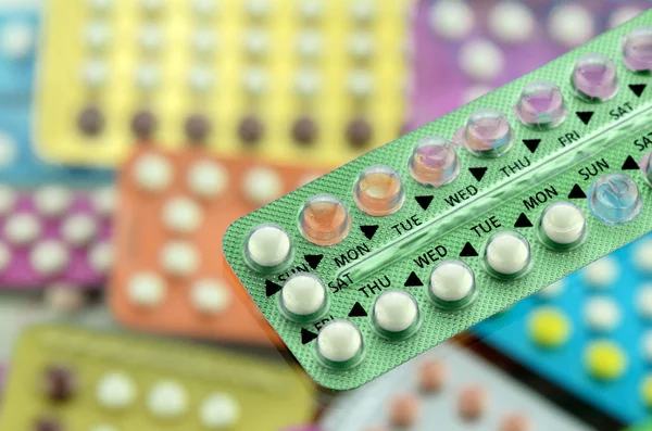 Oral contraceptive pill on pharmacy counter.