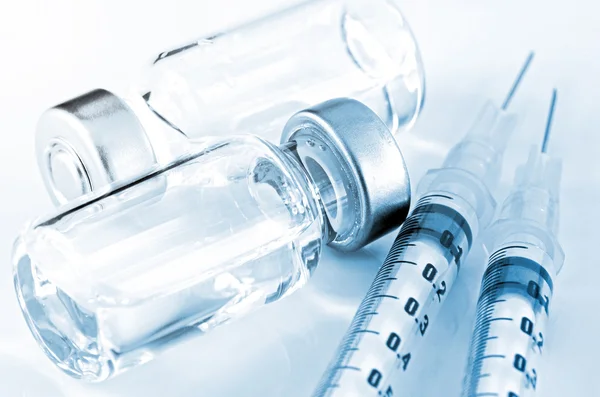 Tuberculin Syringe and Sterile Vial Filled with Medication Solution. An Injection Pharmaceutical Dosage Form.