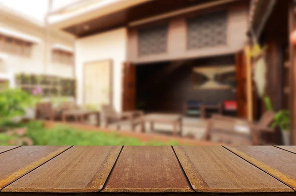 Blurred vintage backyard garden background with perspective wood window view.