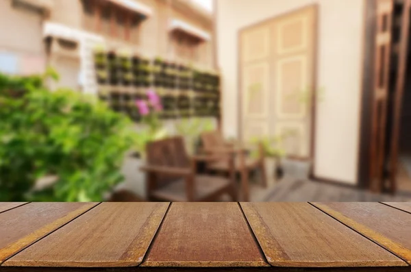 Blurred vintage backyard garden background with perspective wood window view.