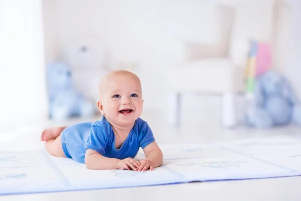 Baby boy in white nursery