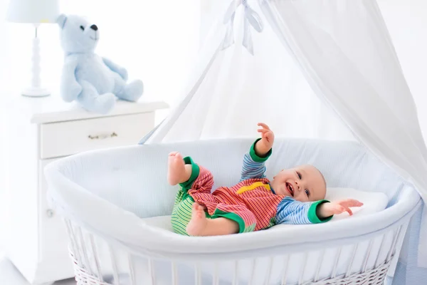 Cute baby in white nursery