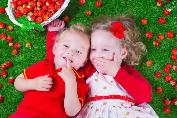 Children eating strawberry