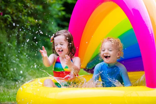 Kids playing in inflatable pool