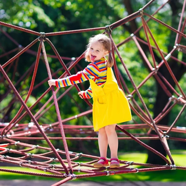 Child having fun on school yard playground