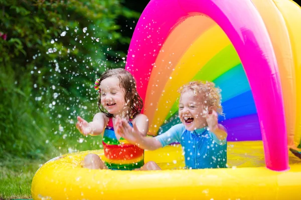 Kids playing in inflatable pool