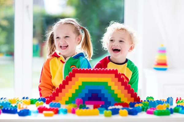 Kids playing with colorful blocks