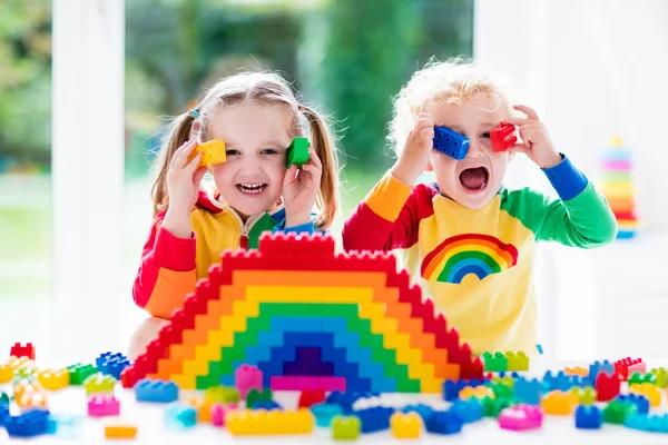 Kids playing with colorful blocks