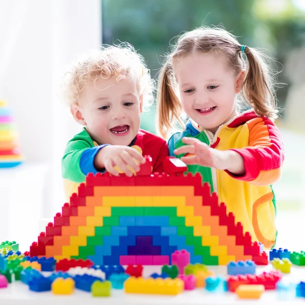 Kids playing with colorful blocks