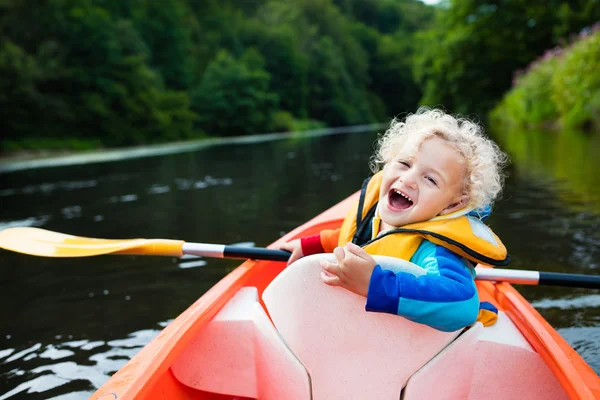 Little boy in kayak
