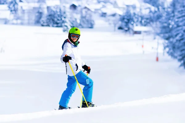 Child skiing in mountains