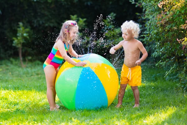 Kids playing with water ball toy