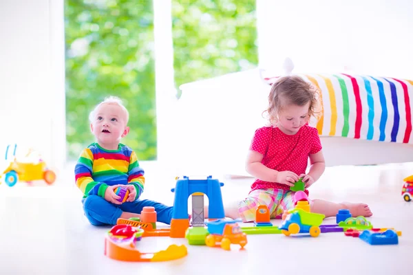 Children playing with toy cars