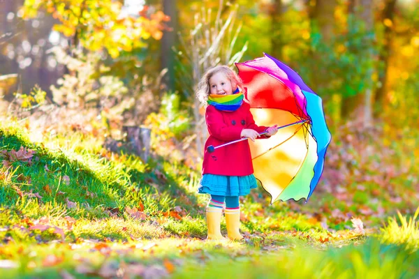Little girl in an autumn park