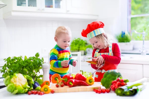 Children preparing healthy vegetable lunch