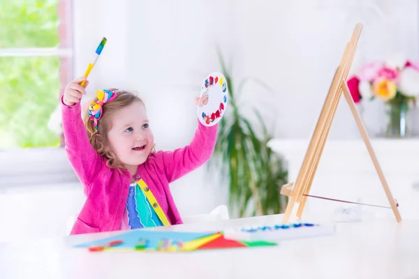 Little girl painting