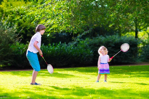 Kids playing badminton