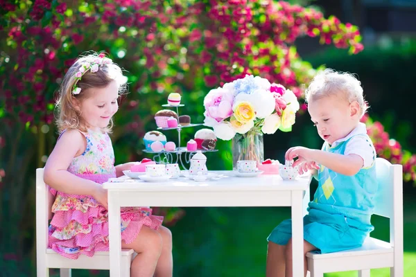Kids having fun at garden tea party