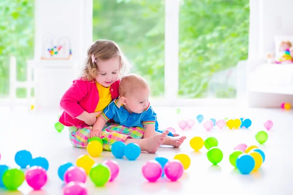 Children playing with colorful toys