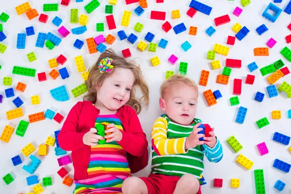 Kids playing with colorful blocks