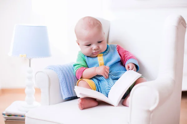 Little boy reading a book