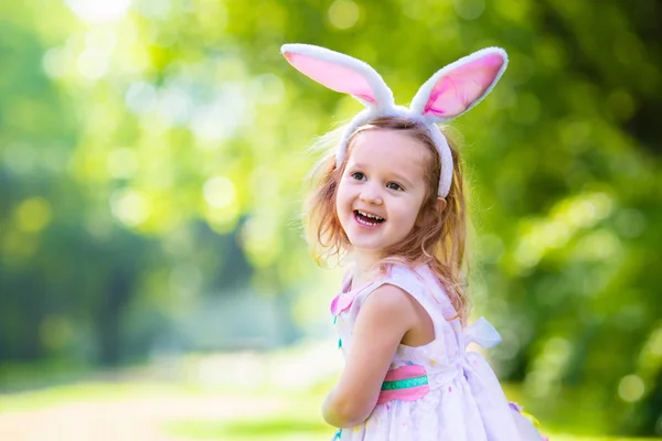 Little girl with white board for Easter greetings