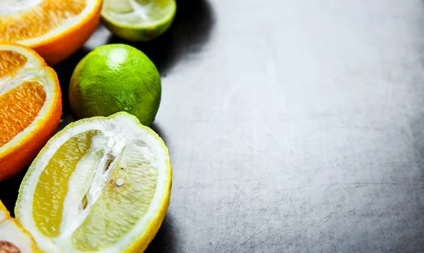 Sliced citrus fruit on a black background. food