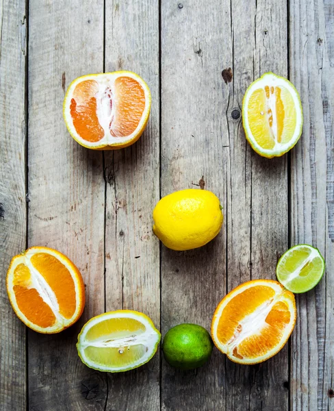 Smile of citrus on a wooden background. food, fruit