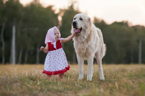 Little girl and a big dog